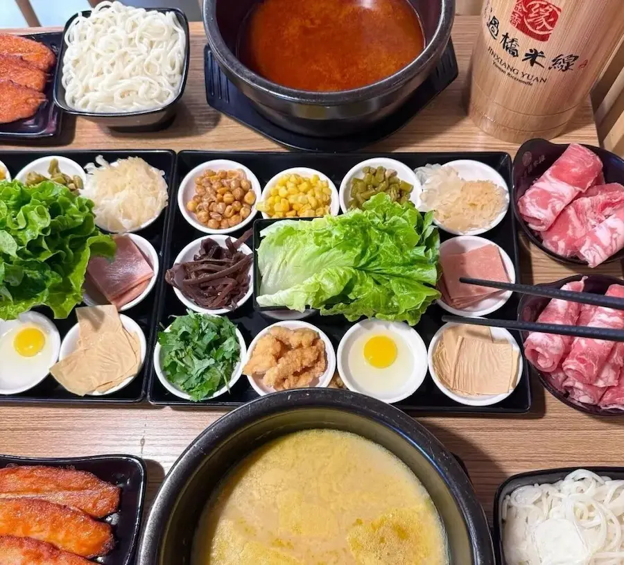 Yunnan crossing bridge noodles full set with raw meat toppings and steaming broth